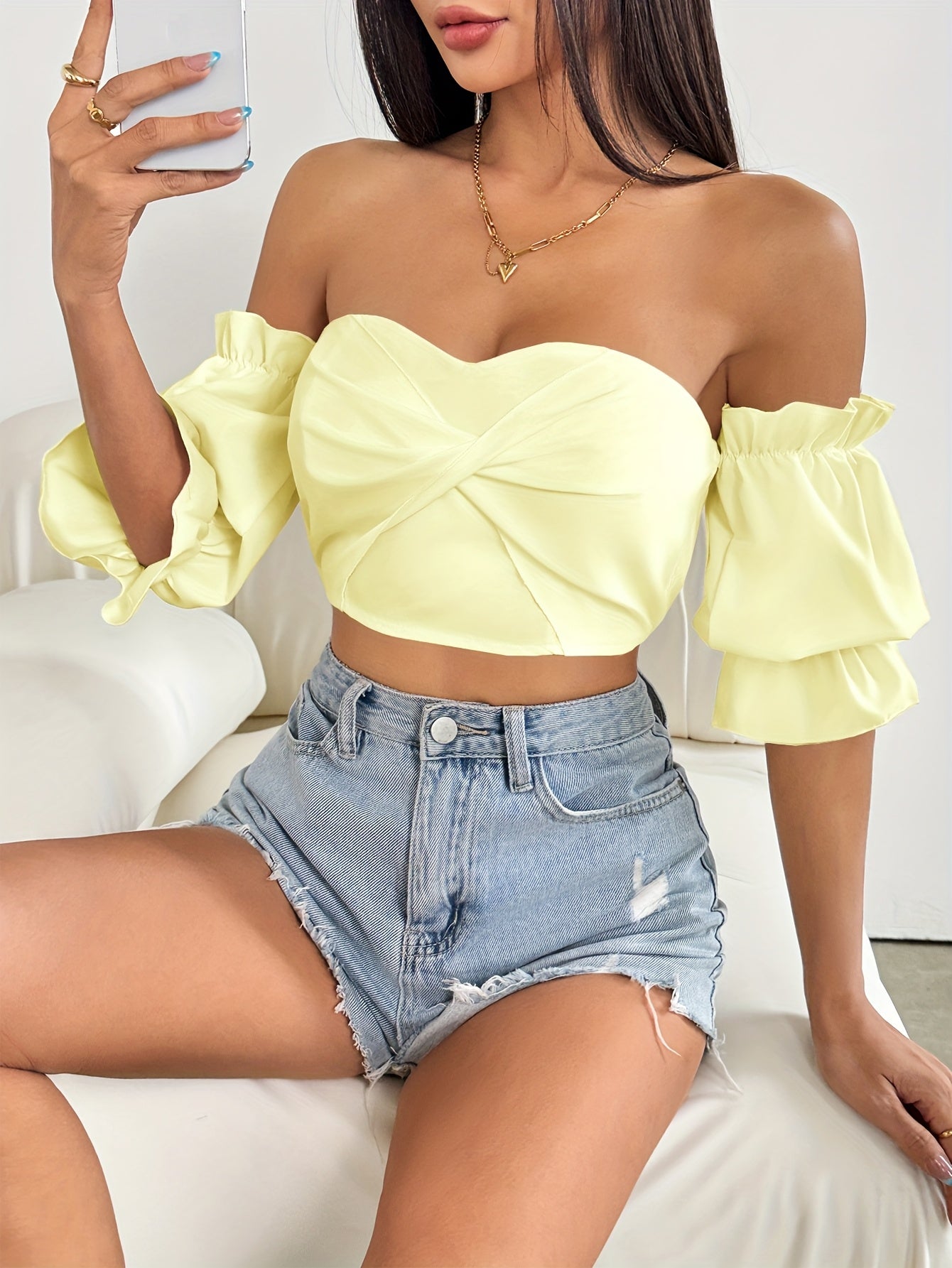 A Stylish Spring Top for Women Featuring a One-Shoulder Design, Low-Cut Neckline, Sweet Bow, And Lantern Sleeves, Designed to Be Form-Fitting And Cropped.