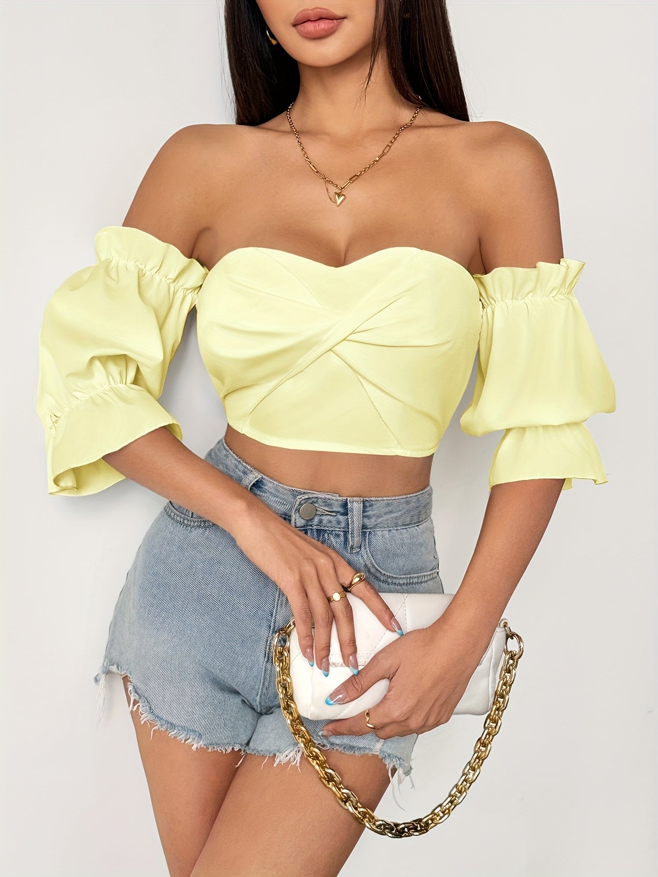 A Stylish Spring Top for Women Featuring a One-Shoulder Design, Low-Cut Neckline, Sweet Bow, And Lantern Sleeves, Designed to Be Form-Fitting And Cropped.