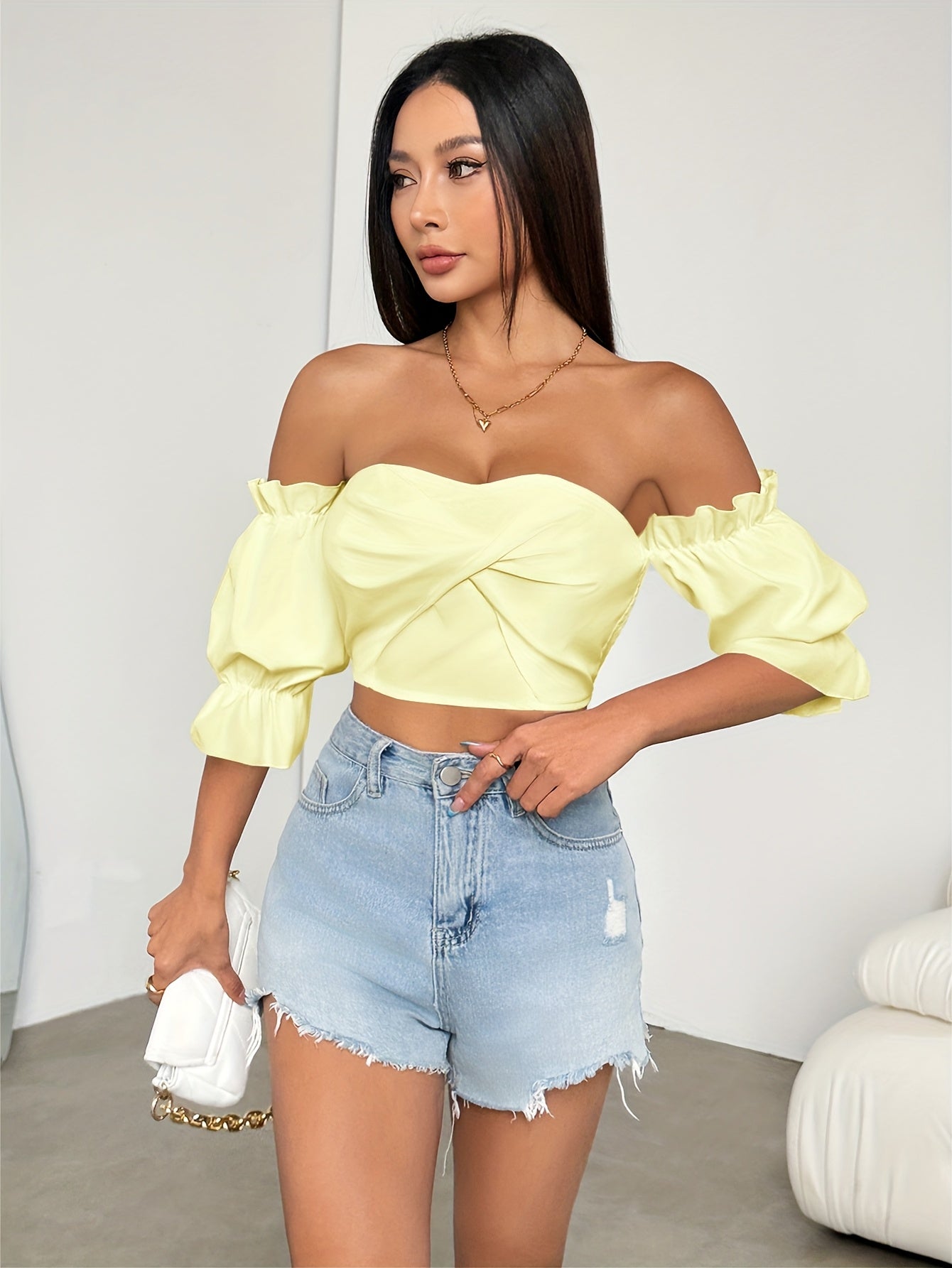 A Stylish Spring Top for Women Featuring a One-Shoulder Design, Low-Cut Neckline, Sweet Bow, And Lantern Sleeves, Designed to Be Form-Fitting And Cropped.