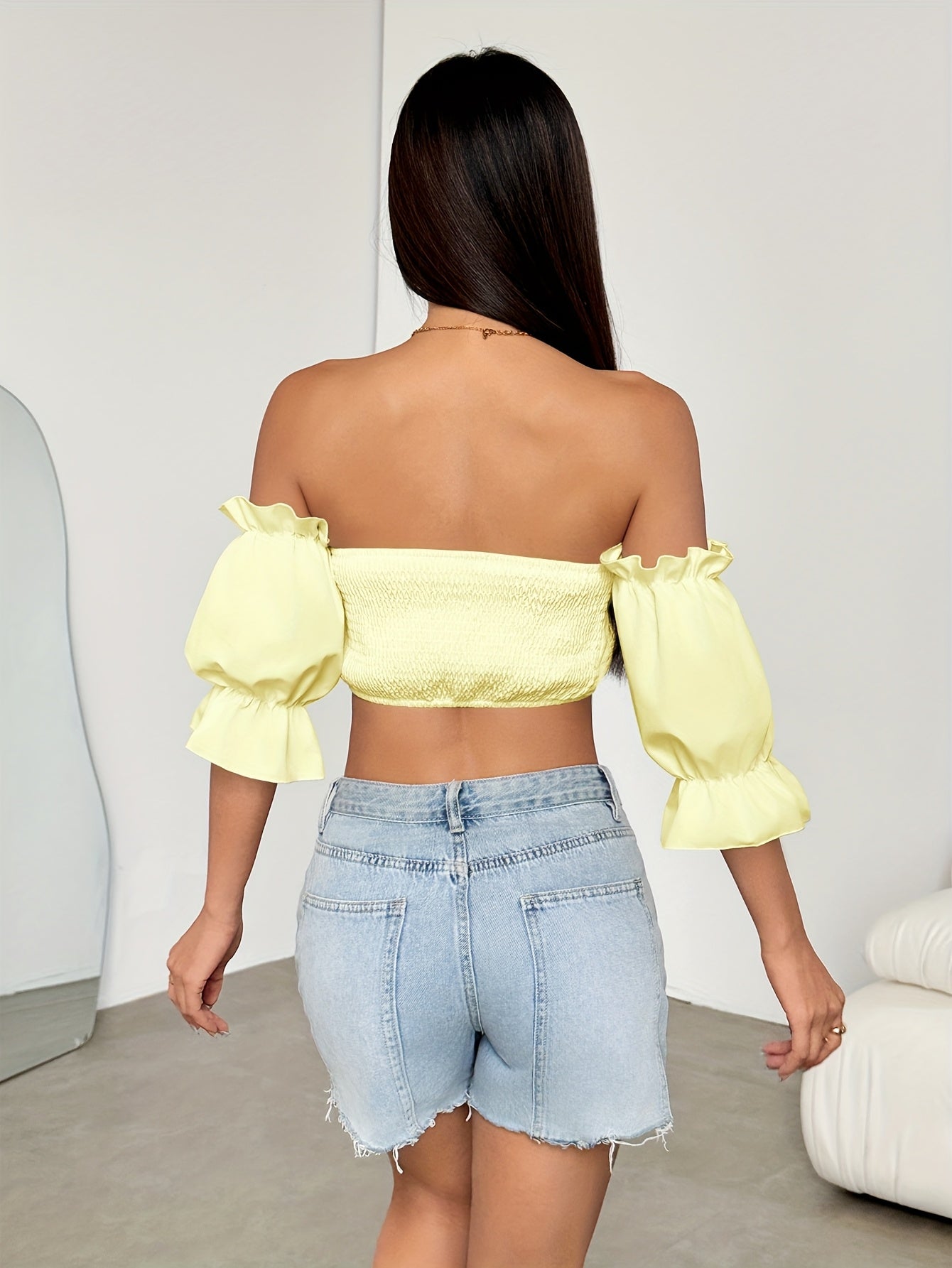 A Stylish Spring Top for Women Featuring a One-Shoulder Design, Low-Cut Neckline, Sweet Bow, And Lantern Sleeves, Designed to Be Form-Fitting And Cropped.
