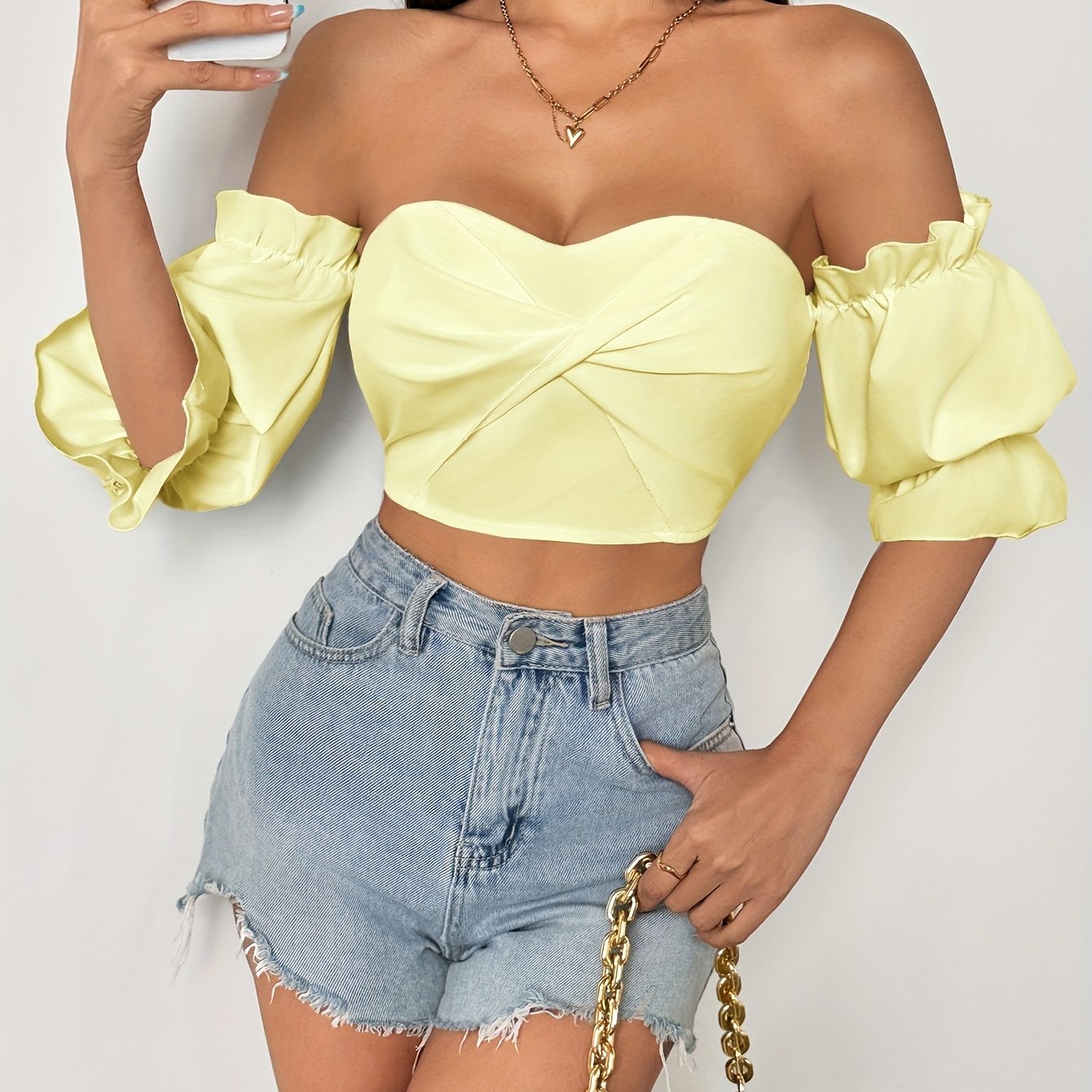 A Stylish Spring Top for Women Featuring a One-Shoulder Design, Low-Cut Neckline, Sweet Bow, And Lantern Sleeves, Designed to Be Form-Fitting And Cropped.